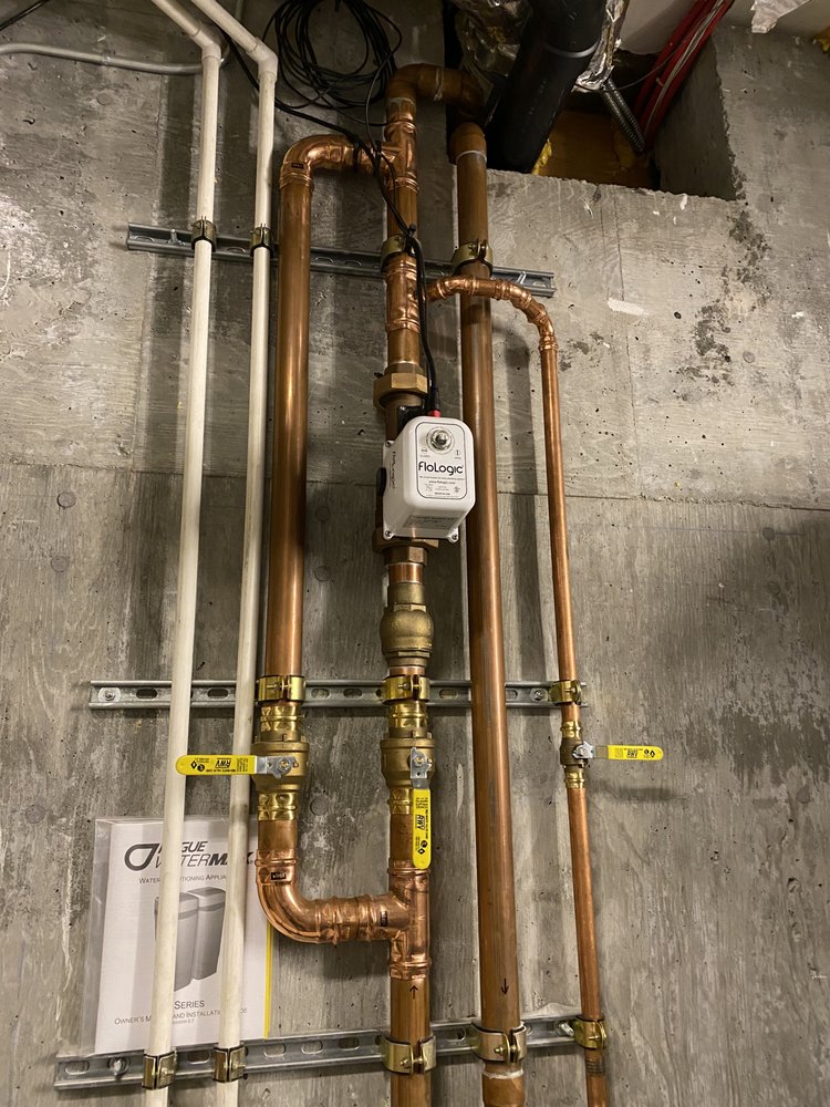 Licensed plumber's clean copper manifold installation in a Nashville home